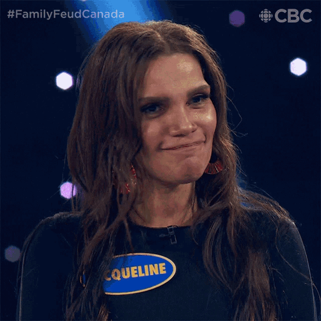 a woman wearing a name tag that says cqueline