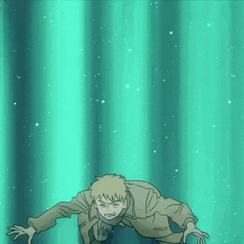 a man in a suit is crawling through a green light .