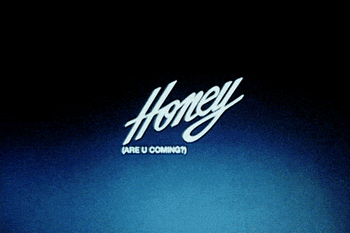 a shirtless man with a tattoo on his chest stands in front of a sign that says honey are u coming