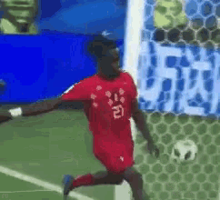 a man in a red jersey with the number 21 on it