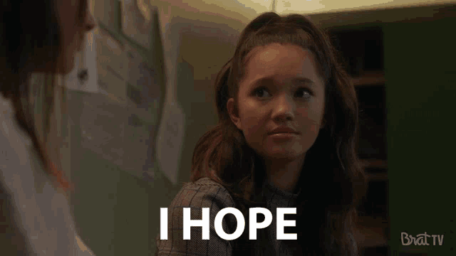 a girl is talking to another girl and says i hope .