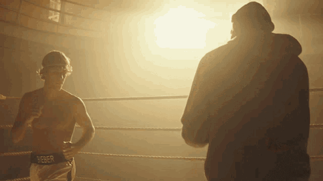 a man in a boxing ring is wearing a belt that says beefr
