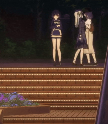 a group of girls standing on a set of stairs