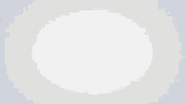 a close up of a blue liquid on a white surface