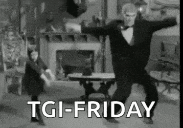 a black and white photo of a man in a tuxedo dancing in a living room with the words `` tgi friday '' .