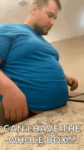 a man with a very large belly is sitting on a counter and asking if he has the whole box .