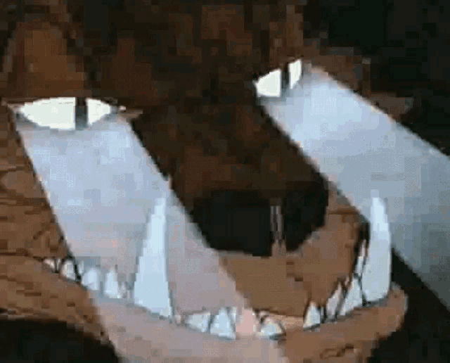 a close up of a cartoon dog 's mouth with its teeth visible .