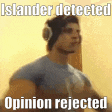 a man wearing headphones is standing in front of a wall with the words `` islander detected opinion rejected '' .