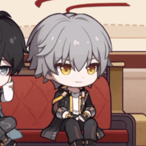 a cartoon character with grey hair and yellow eyes is sitting on a red couch