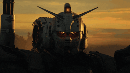 a close up of a robot 's head with a yellow light on