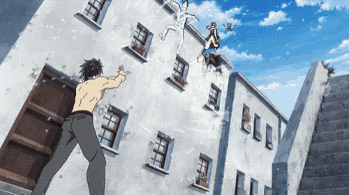 a man without a shirt is standing in front of a building while another man falls off the roof .