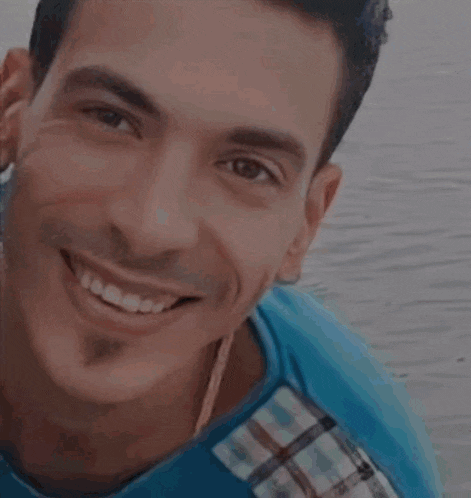 a man is smiling with a lightning bolt coming out of his mouth