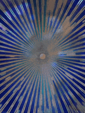 a close up of a blue and gold striped object with a hole in the middle