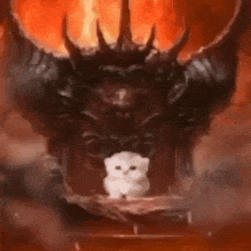 a small white cat is sitting in front of a large demon with horns .