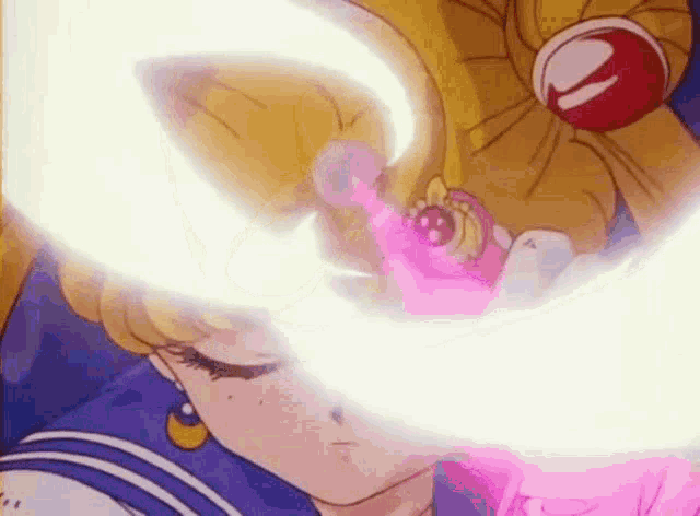 a girl in a sailor suit is holding a pink wand in front of her eyes .