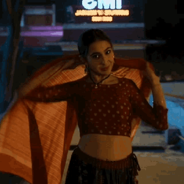 a woman is standing in front of a sign that says 2mi on it
