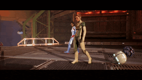 a woman in a futuristic suit stands next to another woman