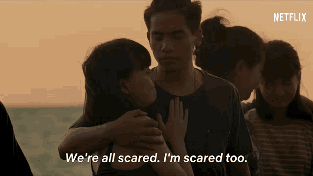 a netflix ad shows a group of people hugging and says we 're all scared