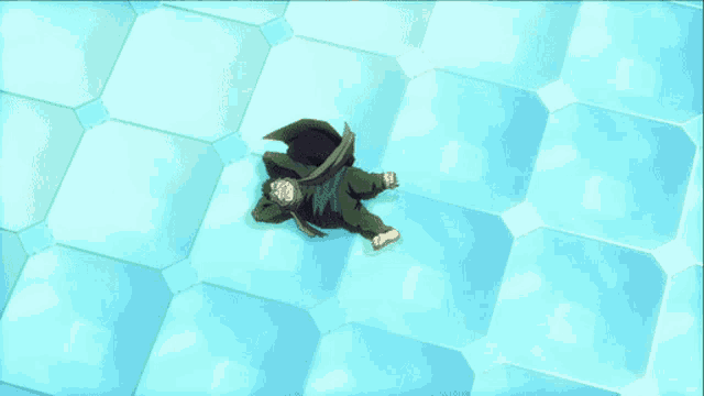 a man in a cape is laying on a blue tiled floor