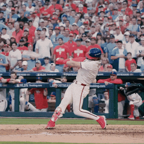 a baseball player is swinging at a pitch in front of a banner that says fields
