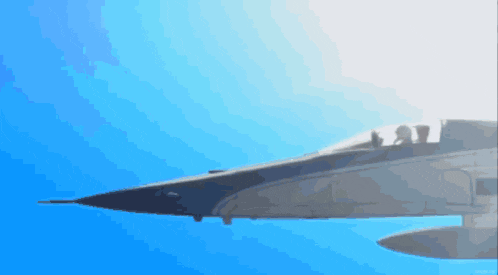 a pixelated image of a fighter jet flying in the blue sky