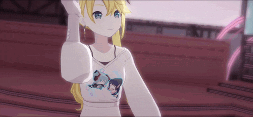 a girl with blonde hair and blue eyes is wearing a white shirt with a picture of a boy on it .