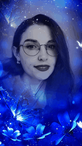 a woman wearing glasses surrounded by blue flowers
