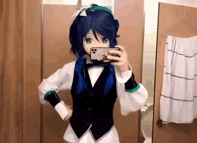 a person in a costume is taking a selfie in front of a mirror in a bathroom .