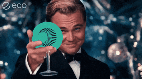 a man in a tuxedo is holding a green circle in front of his face and the word eco is on the bottom