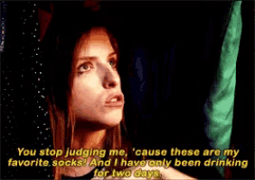 a woman is covering her mouth with her hand while someone says you stop judging me cause these are my favorite socks