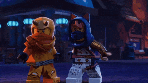 two lego characters are standing next to each other in a dark room