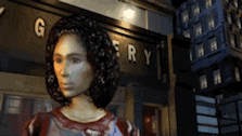 a mannequin is standing in front of a building with the word gallery on it