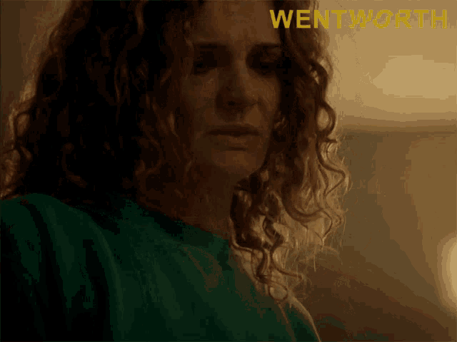 a close up of a woman 's face with the word wentworth on the bottom right