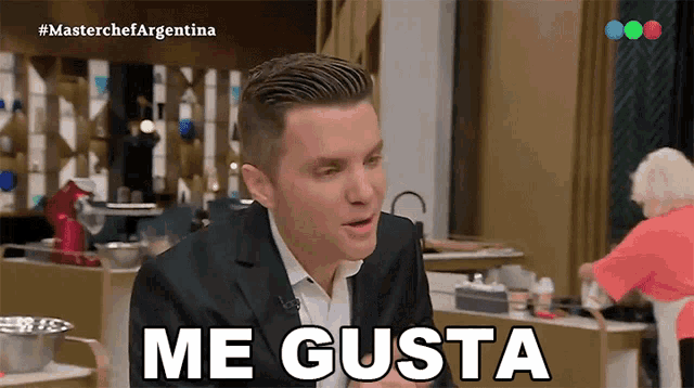 a man in a suit says me gusta on a tv show