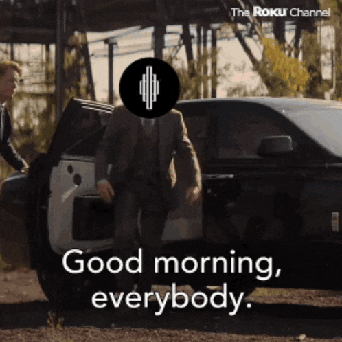 a man in a suit getting out of a car with the words good morning everybody