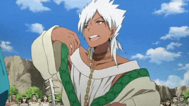a man with white hair stands in front of a crowd