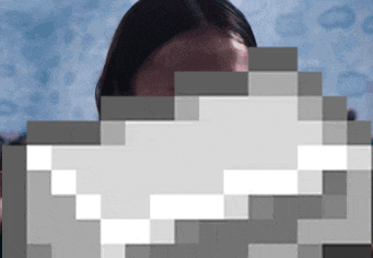 a pixelated image of a woman 's face with a cloudy sky in the background