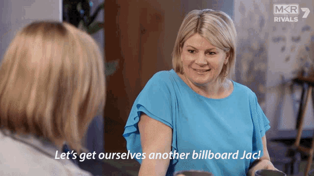 a woman in a blue shirt says let 's get ourselves another billboard jack