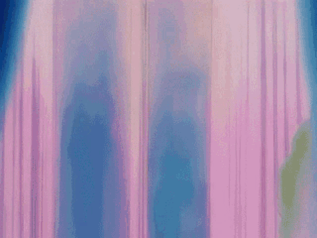 a couple of anime characters are standing next to each other in front of a window .