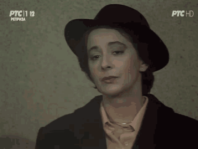 a woman wearing a black hat is on ptc hd