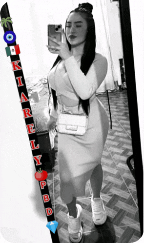 a black and white photo of a woman taking a selfie with the name kiarely written on the bottom