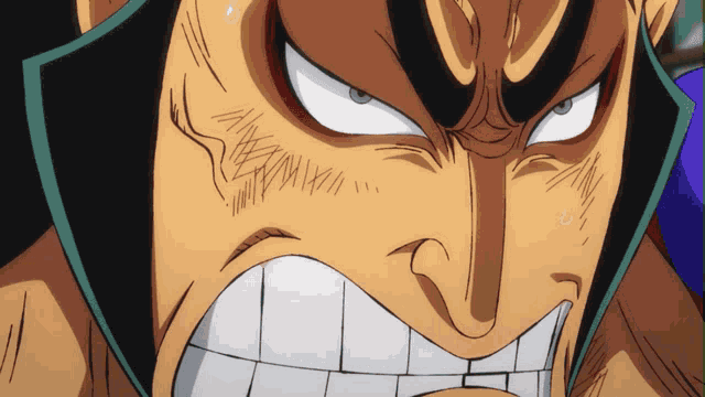 a close up of a man 's face with a very angry look on his face