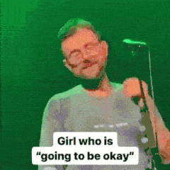 a man singing into a microphone with the words girl who is going to be okay