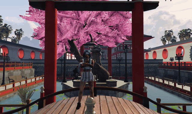 a woman in a plaid skirt stands under a cherry blossom tree