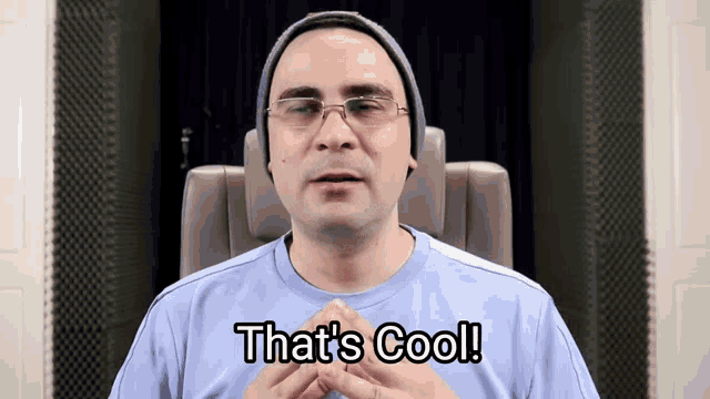 a man wearing glasses and a hat says " that 's cool "