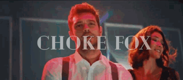 a man and a woman are dancing in front of the words choke fox