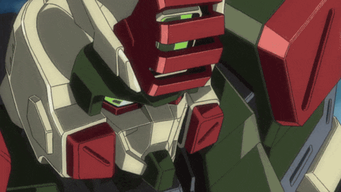 a close up of a robot 's head with a green light on it