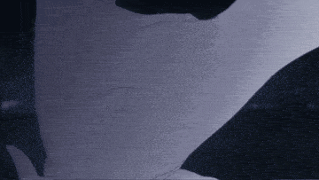 a close up of a person 's torso with a purple background