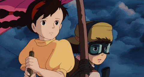 a girl holding an umbrella and a boy wearing goggles