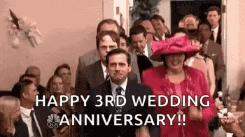a man in a suit and tie is walking down the aisle at a wedding ceremony .